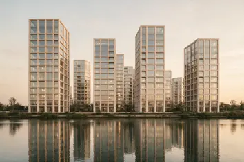 Central towers: residential towers reflected in still water at dusk
